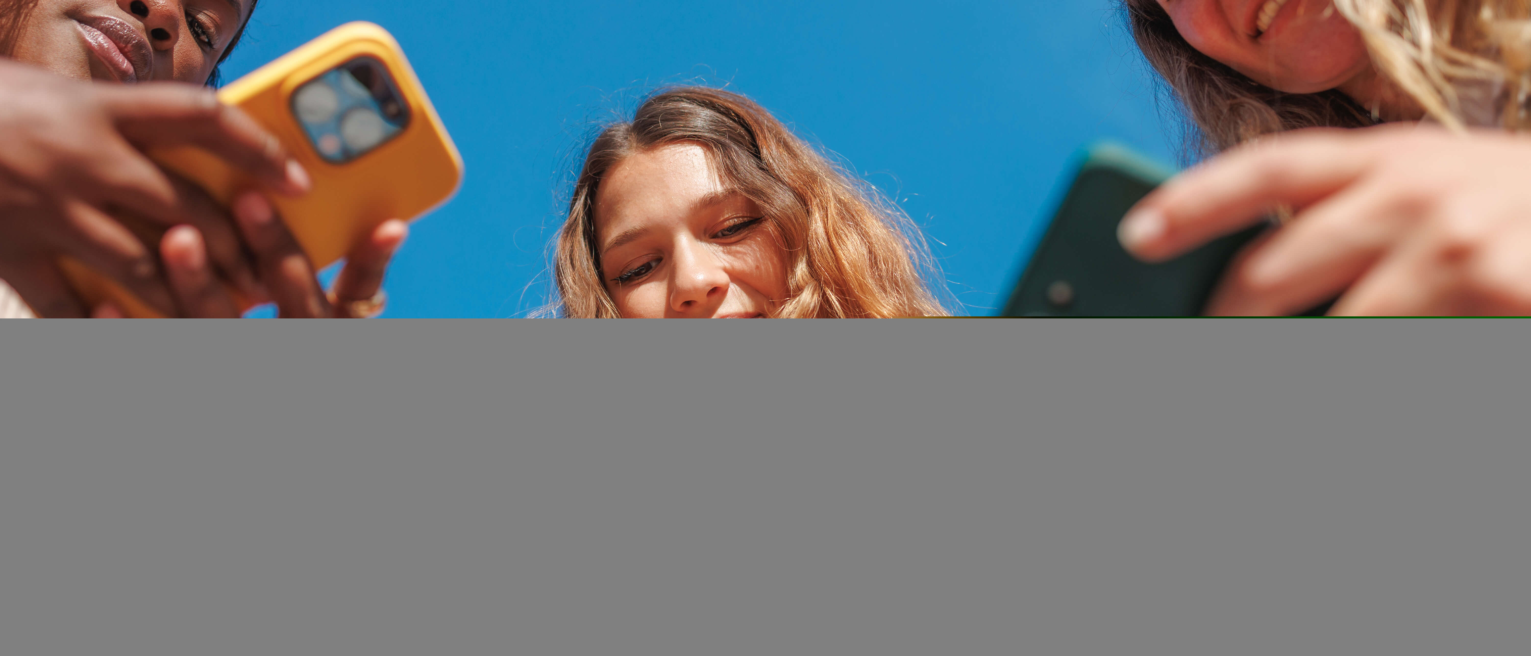 Group of students looking at phones
