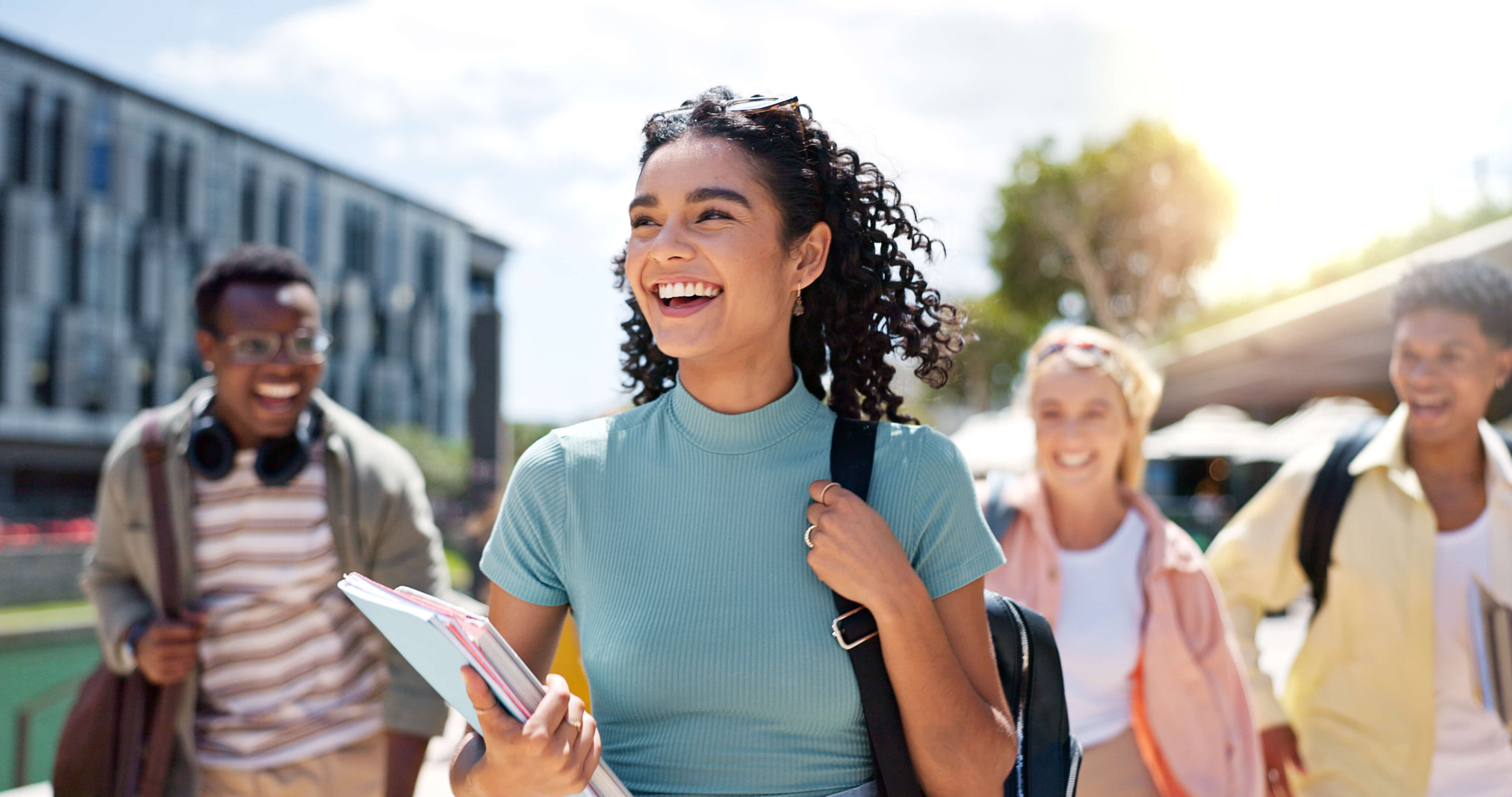 Girl walking with friends at university