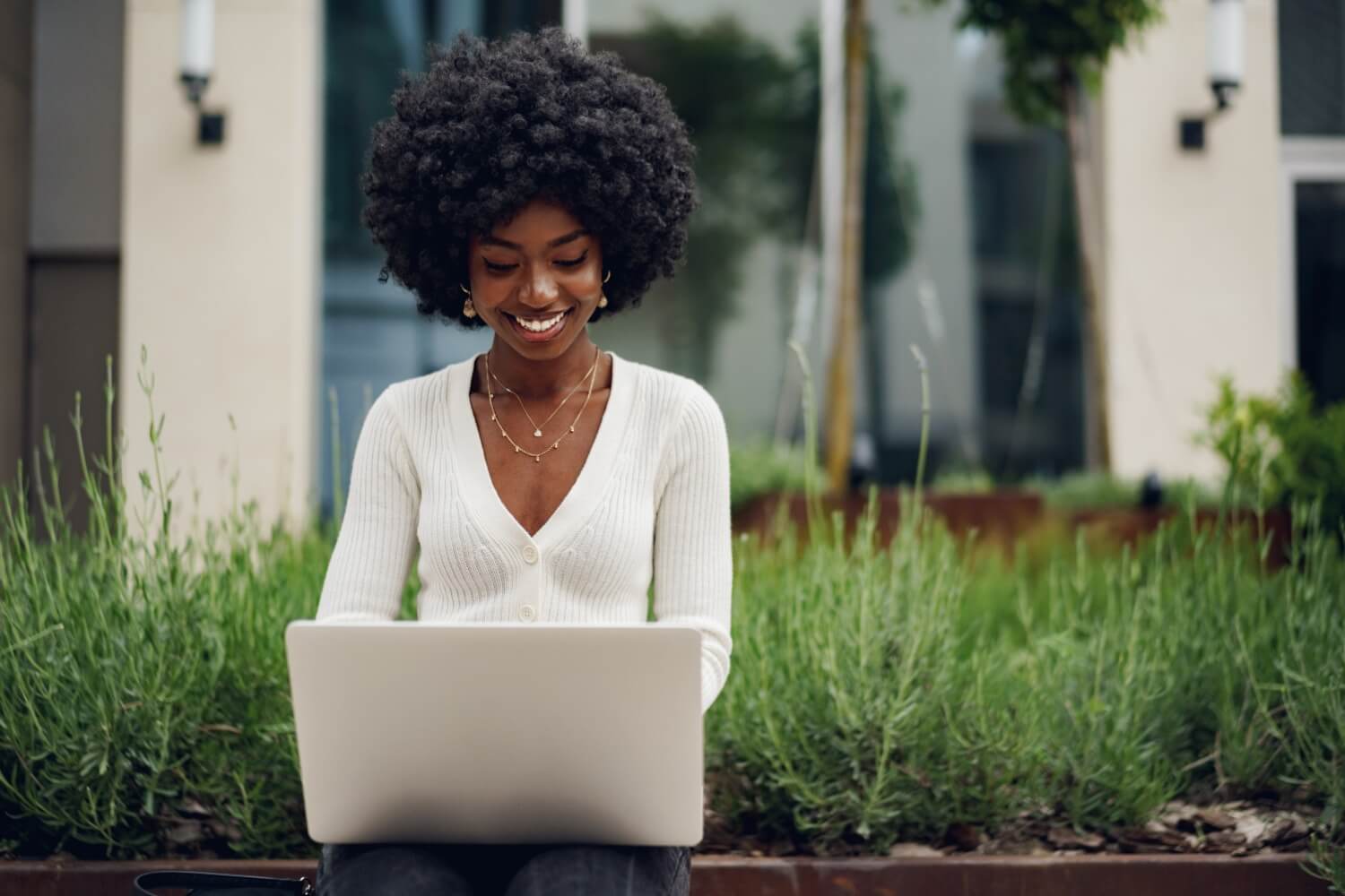 Smiling woman looking at laptop