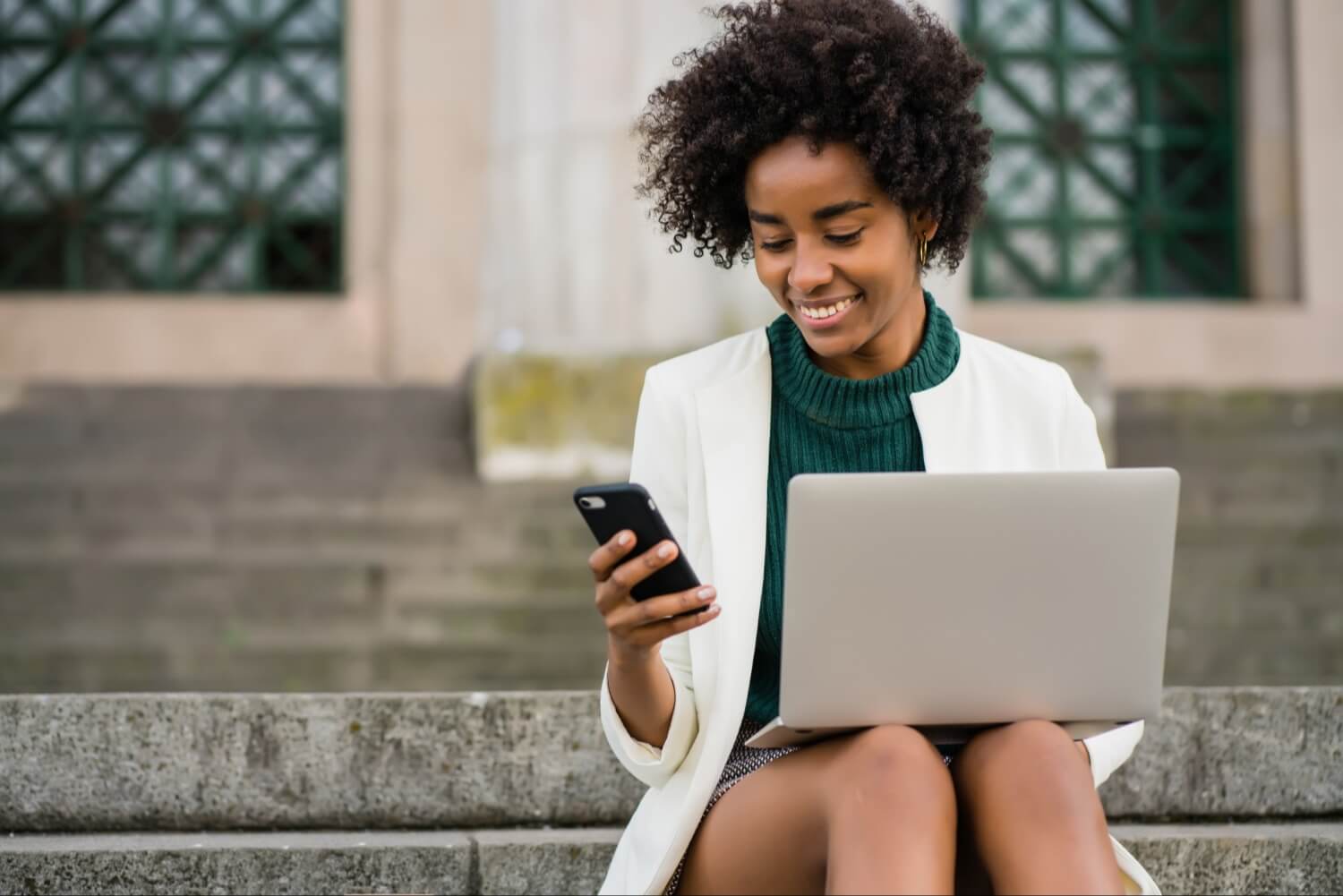 Smiling woman using phone
