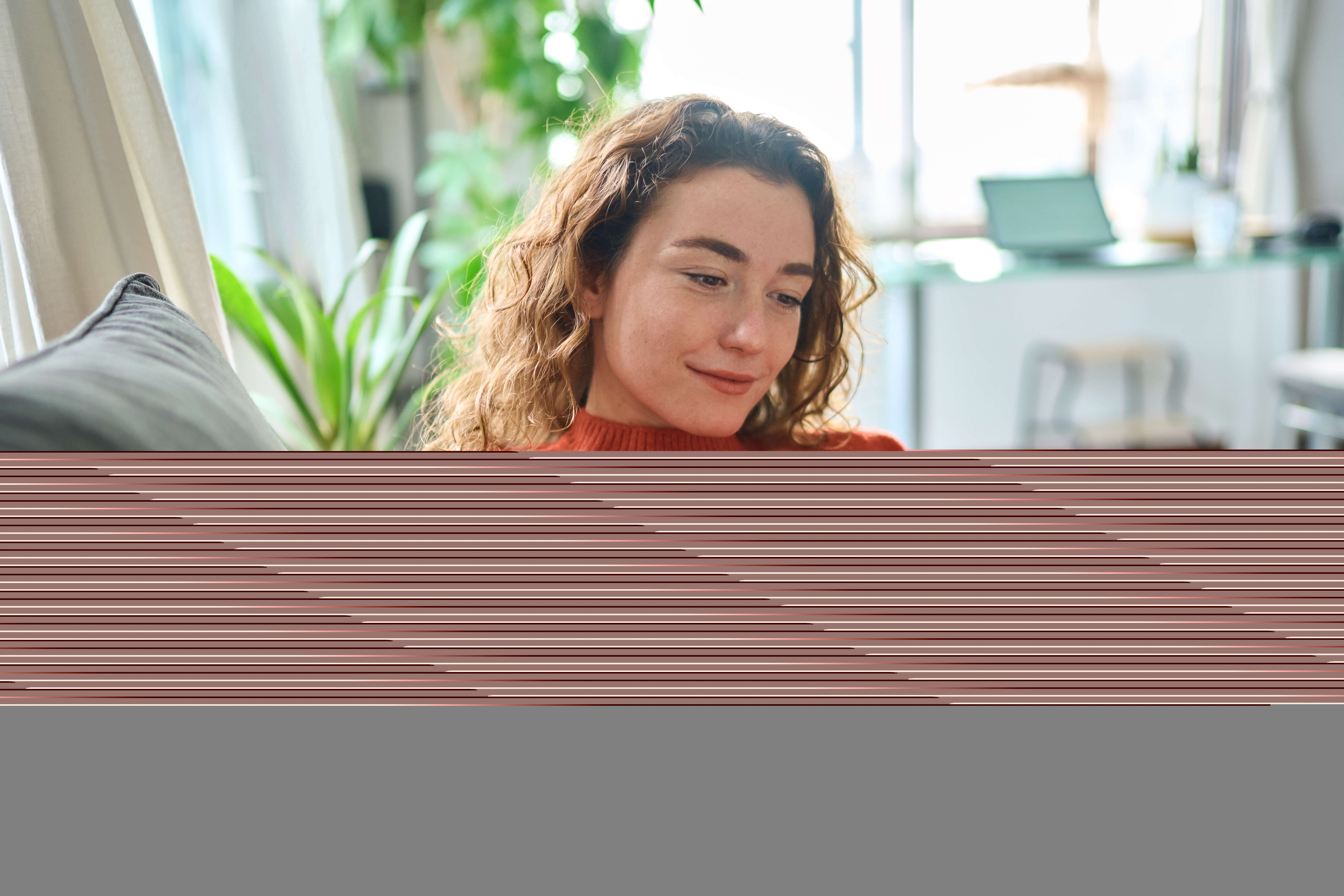 Smiling woman using phone